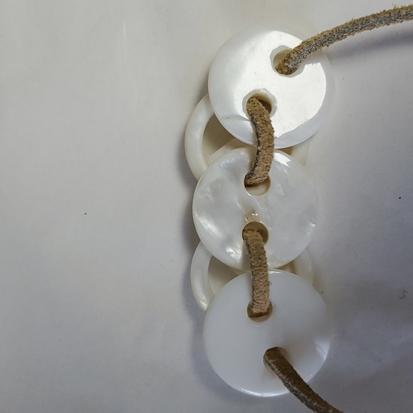 Mother of pearl 1/2" round with two holes for crafts - Picture 2 of 3